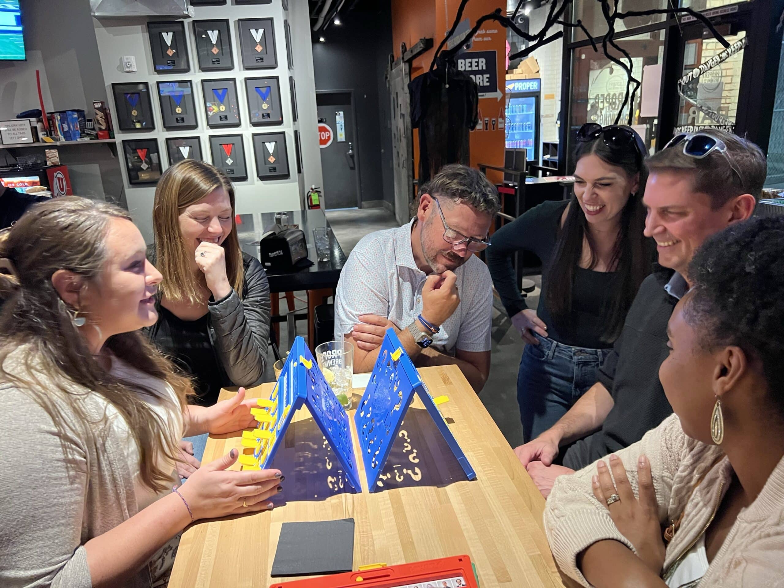 Group playing board game in a bar