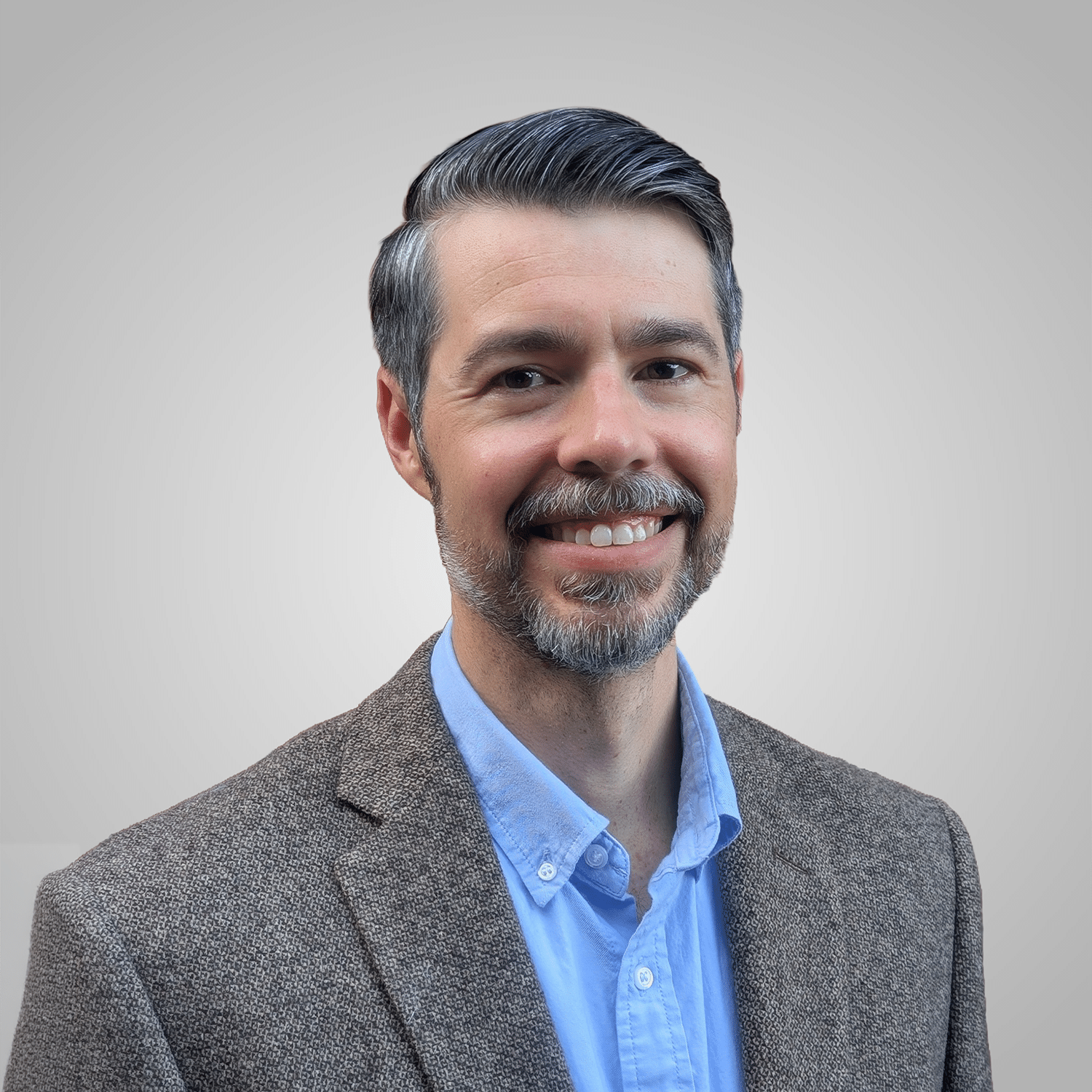 long square Smiling man in blazer and blue shirt portrait