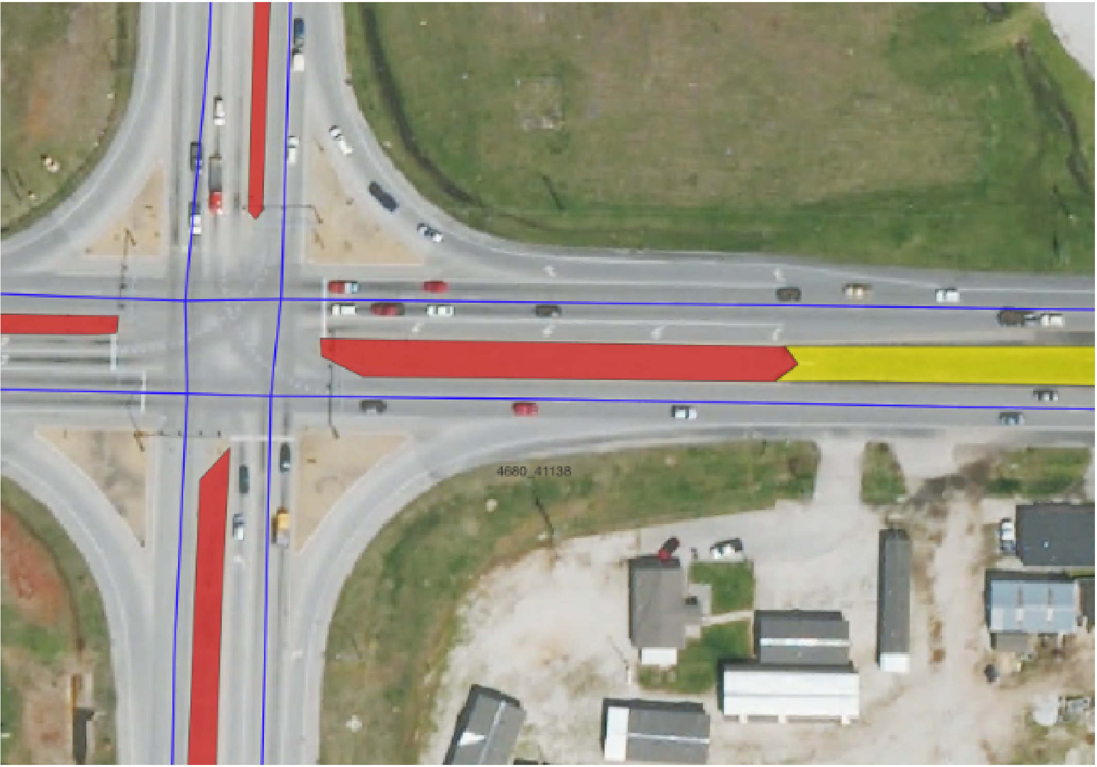 Aerial view of traffic intersection with highlighted lanes.